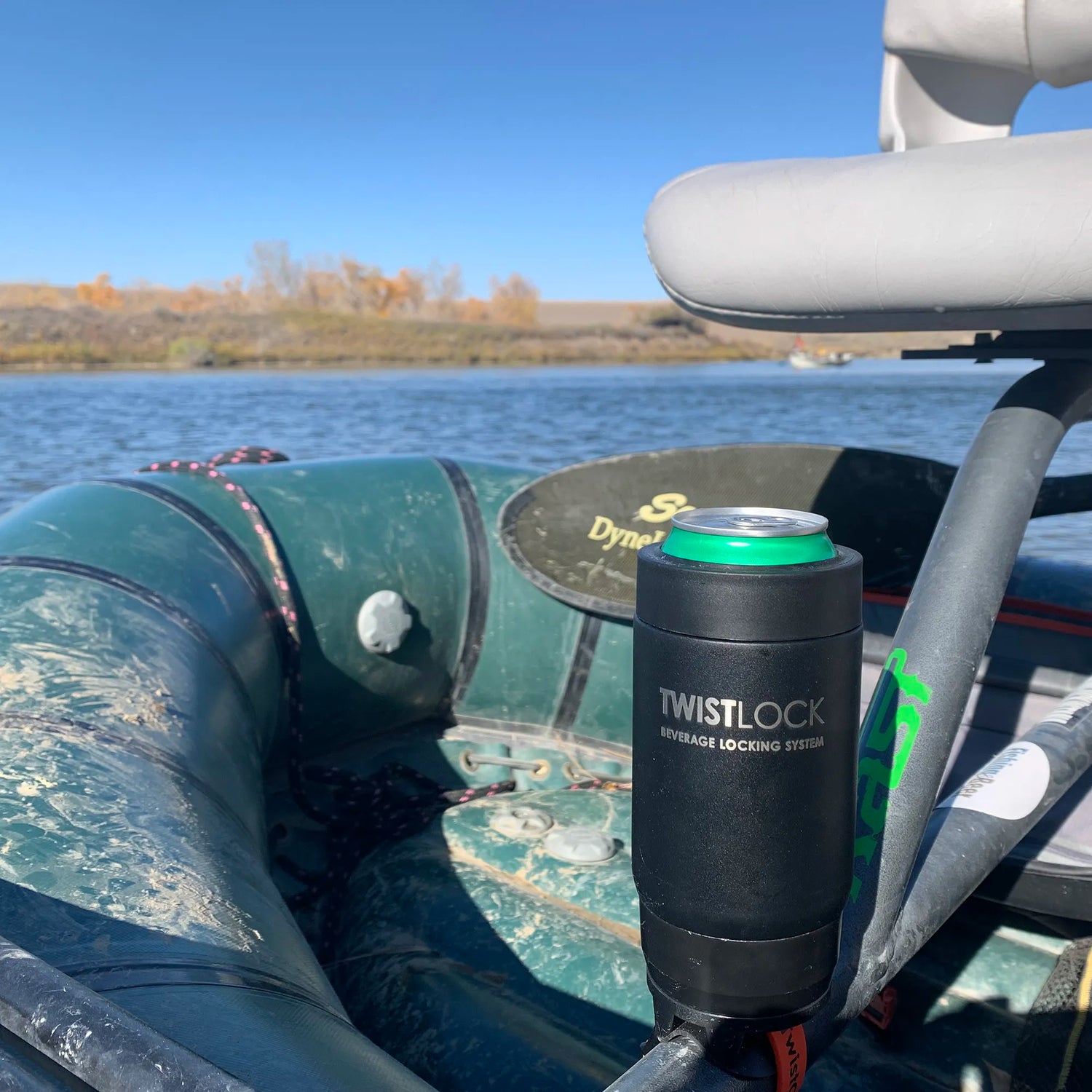 Old raft with a bar mount locking cup holder attached to the frame with a can cooler in it.