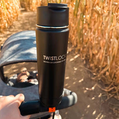 Drinkware attached to a stroller handlebar using the bar mount base.