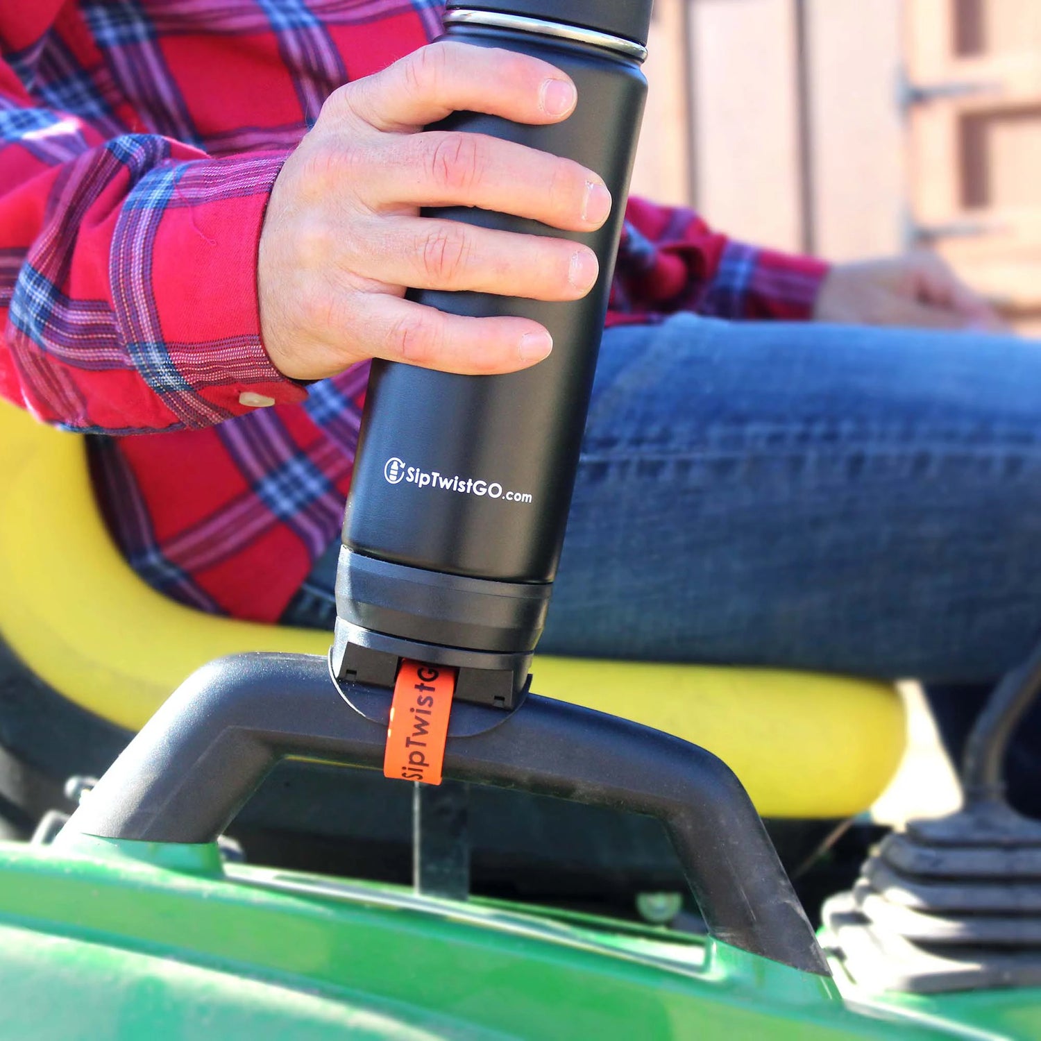 Insulated drinkware attached to a small tractor using a removable base.