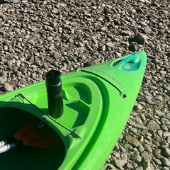 Canteen and mini disc locking cup holder added to the front of a bright green kayak.