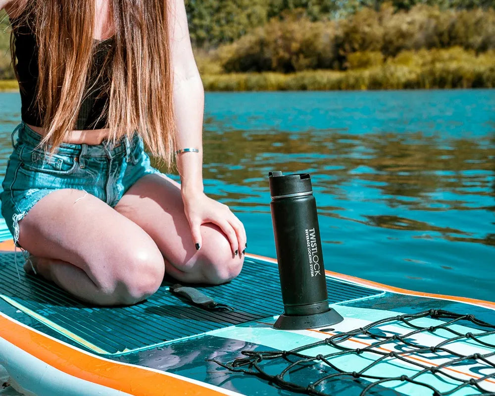 Paddle board and secure cup holder with her insulated canteen attached in.