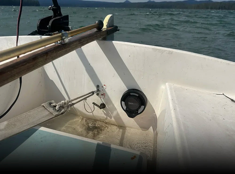 The TwistLock folding vertically mounted locking cup holder attached to a sailboat in the closed position.