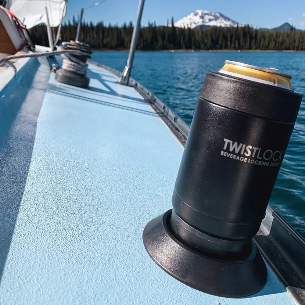 Sailboat on mountain lake with an insulated can cooler attached to a secure cup holder.