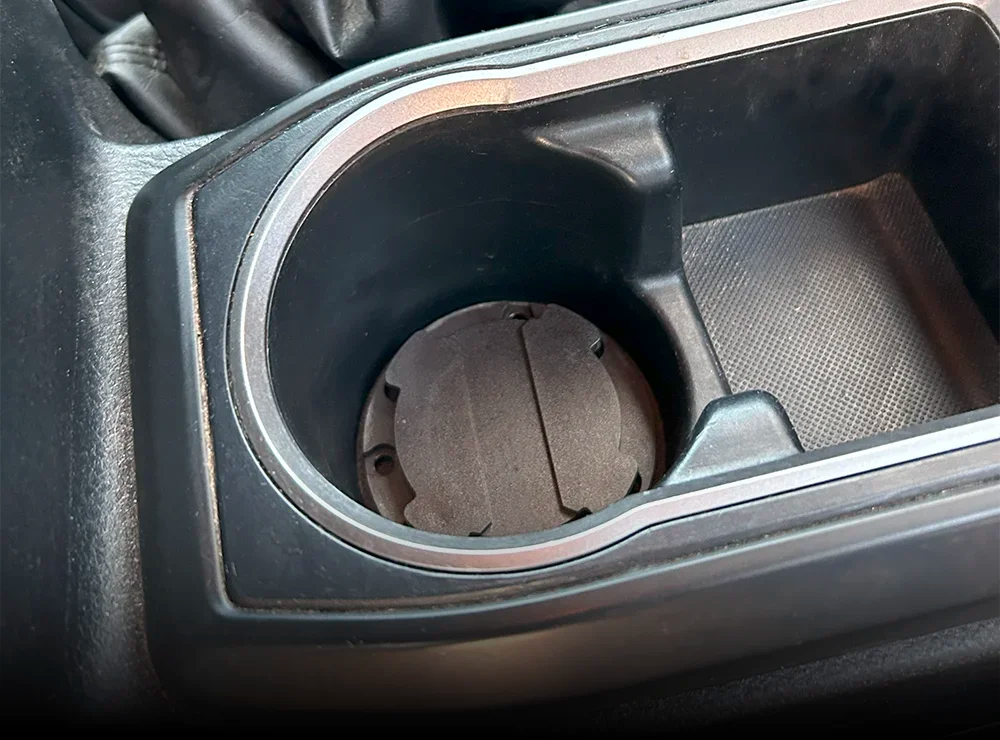 TwistLock Mini Disc Locking Cup Holder attached inside a trucks cup holder.