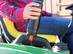 Locking cup holder added on a tractor grab handle with an insulated canteen locked in.