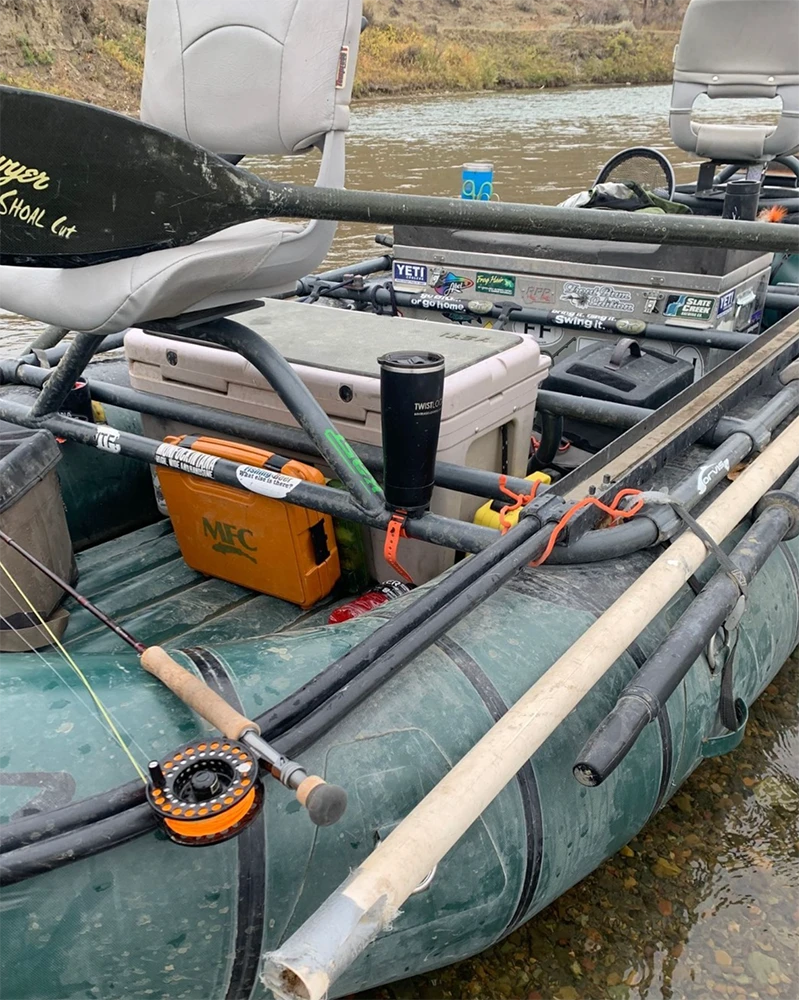 Whitewater raft with removable bar mount cup holder and a Tumbler attached to the frame.