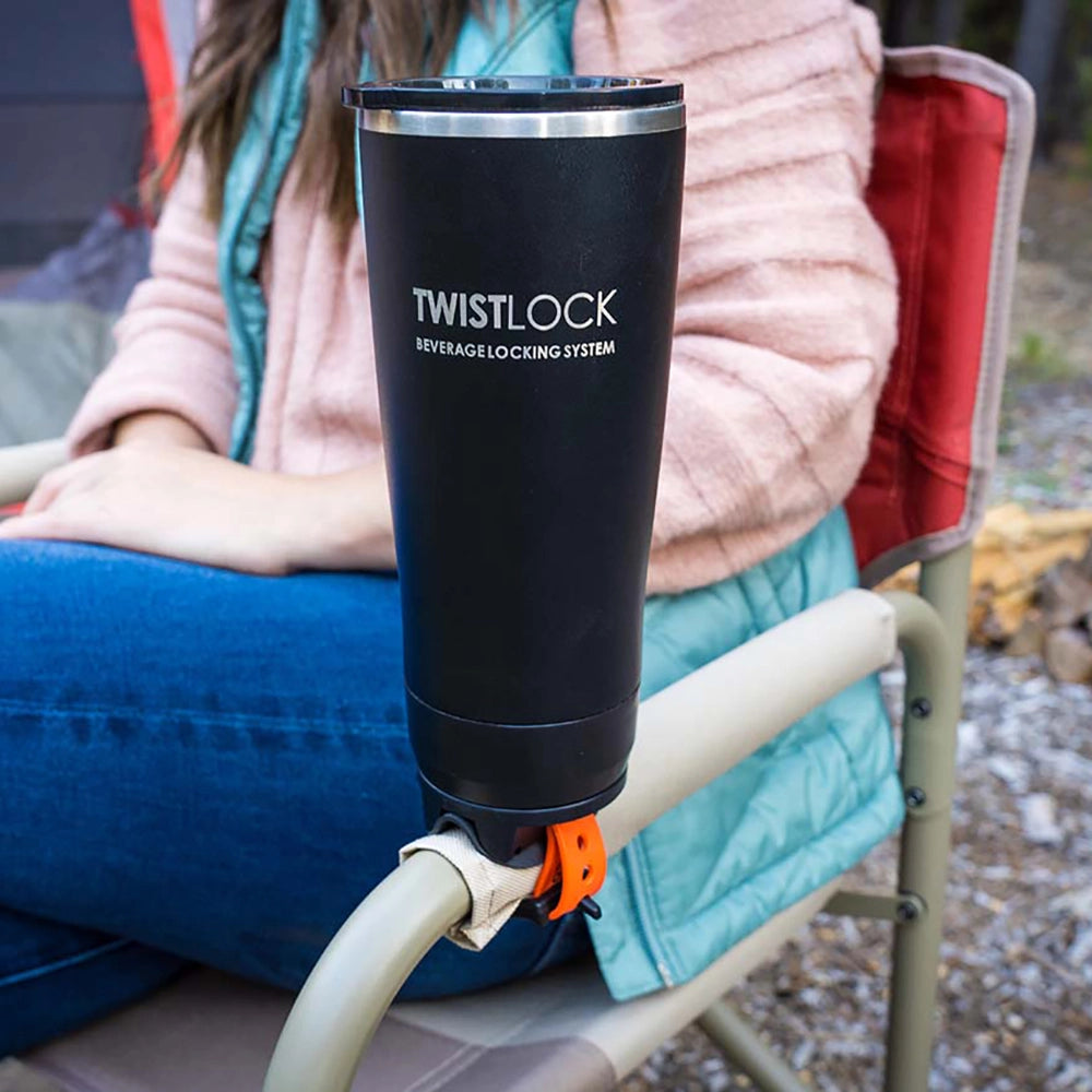 Attachable cup holder bar mount on camping chair with a insulated tumbler locked into it.