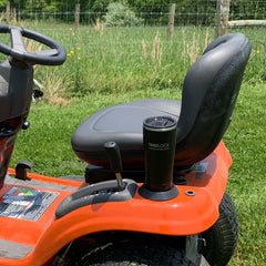 Orange tractor with flat mount locking cup holder attached with an insulated tumbler in it.