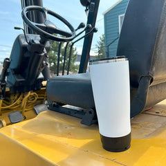 Summit White TwistLock insulated 22oz Tumbler locked  to a mini disc attachable cup holder on an heavy duty forklift.