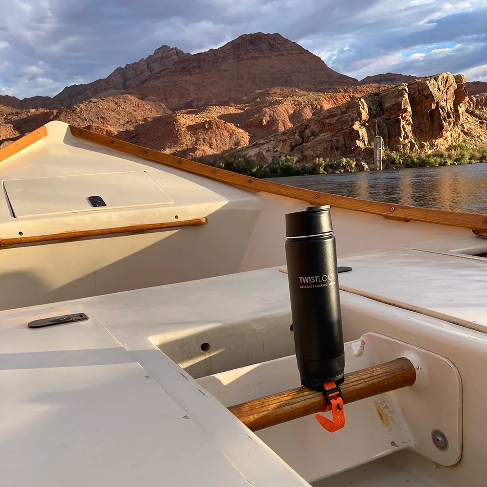 Bar Mount cup holder attached to a boat and an insulated canteen secured in.