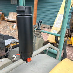 Bar mount locking cup holder attached to an excavator with an insulated canteen.