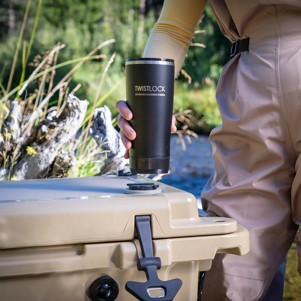 insulated tumbler locking into a lid of a cooler by a fisher.