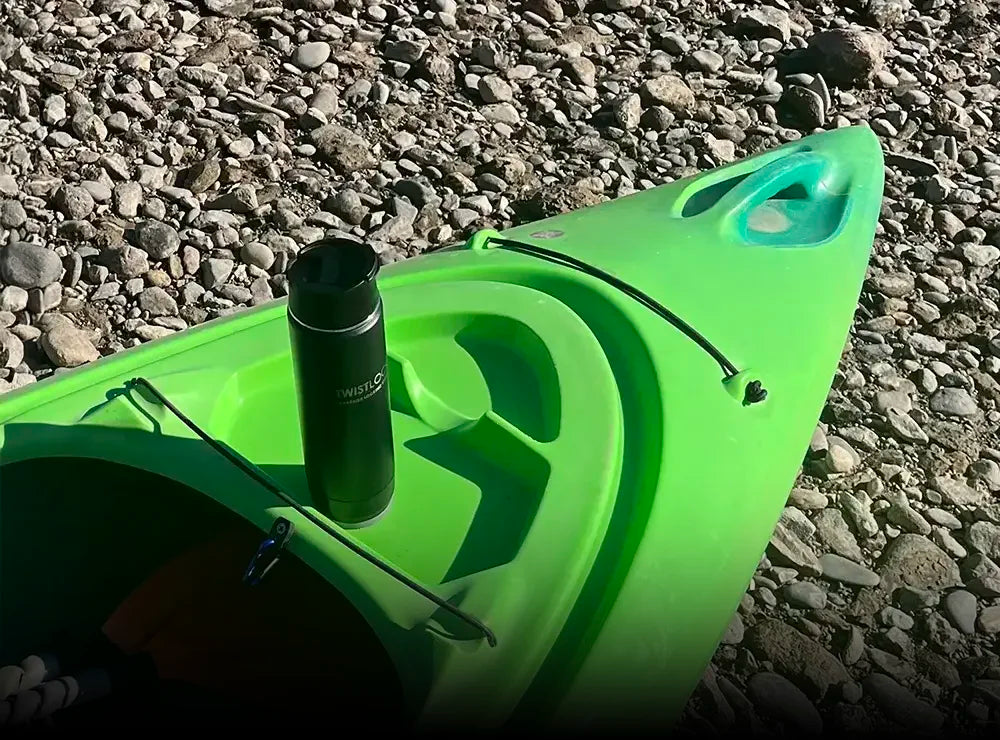 TwistLock Mini Disc Locking Cup Holder attached to a kayak with an insulated 20oz canteen.