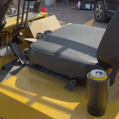 Locking a can cooler onto a cup holder on a forklift.