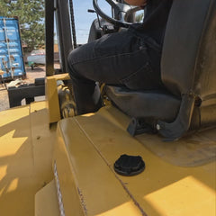 Showing a TwistLock Canteen being locked into the secure mini disc cup holder on the side of a forklift.