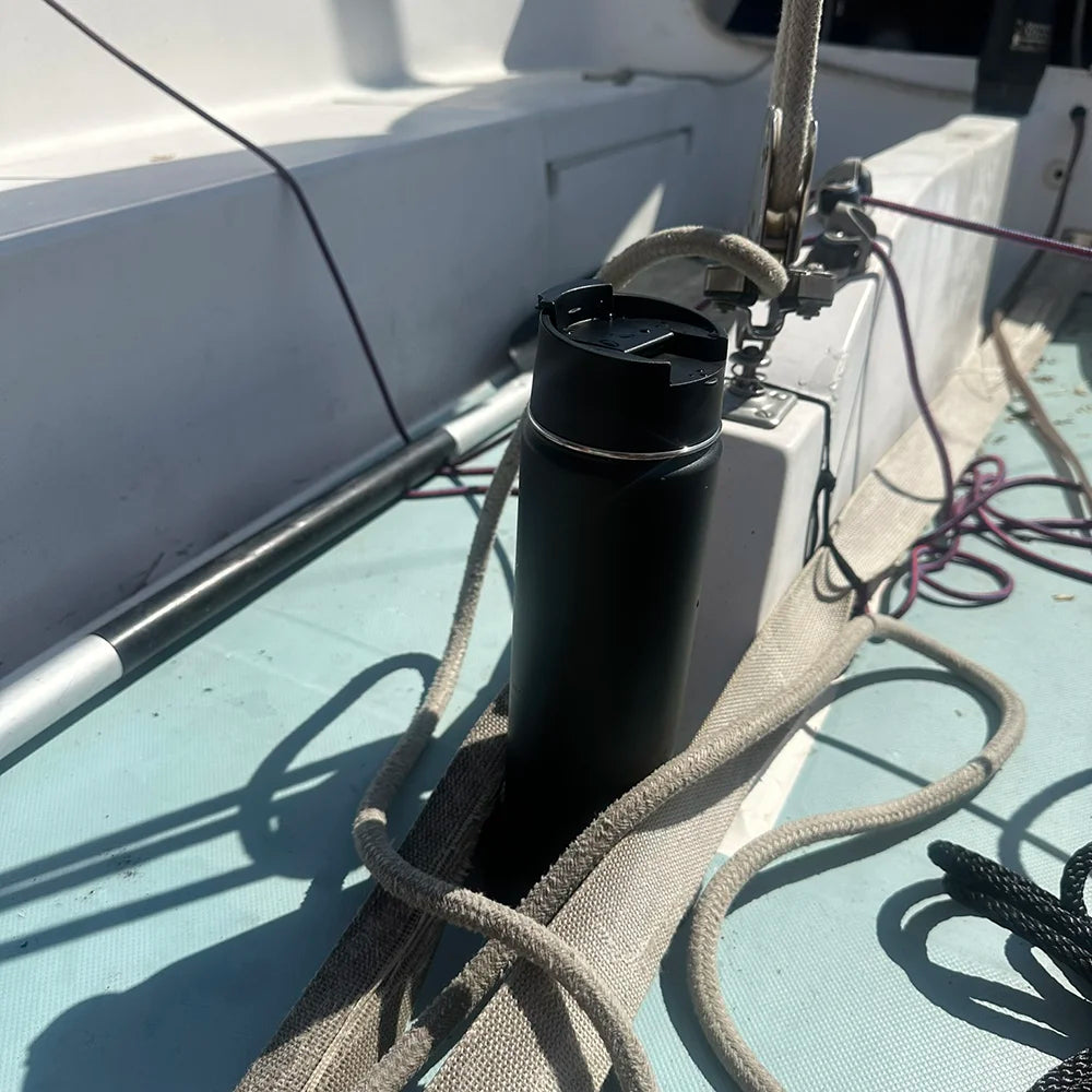 Insulated canteen attached to a sailboat with a secure locking mini disc cup holder.