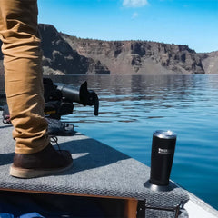 Boat cup holder securely holding an insulated tumbler.