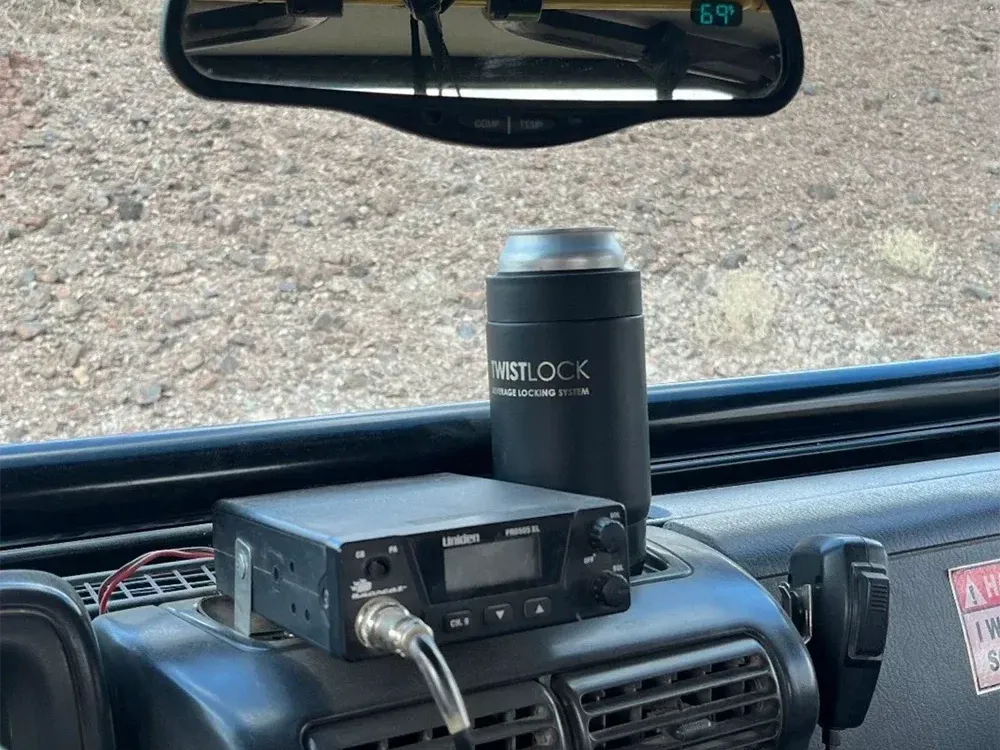 Car dash with a locking, secure cup holder and insulated can cooler.