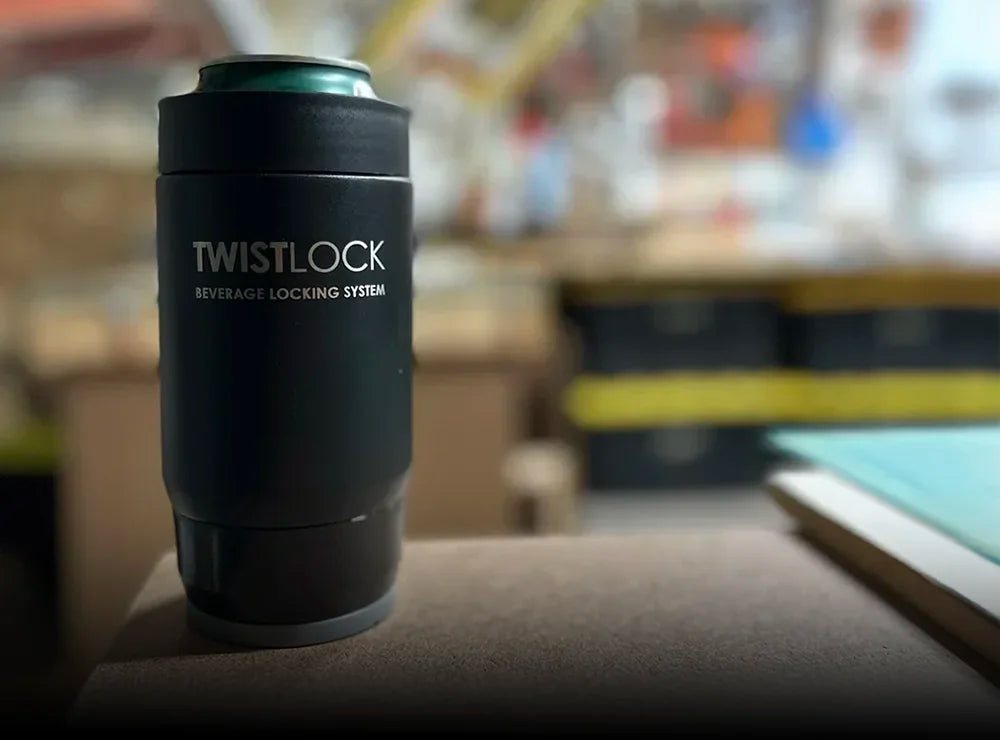 TwistLock Mini Disc Locking Cup Holder attached to a work station with a 12oz stainless steel insulated can cooler.